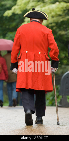 Chelsea Pensioner wearing the famous scarlet coat and tricorne hat in Hyde Park London Stock Photo