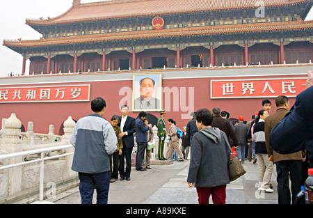 CHINA BEIJING Chinese couples pose to have their photos made in front of the giant portrait of Chairman Mao Stock Photo