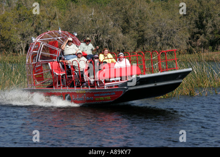 Florida,Polk County,Lake Kissimmee,Camp Mack's River Resort Airboat Tour,passenger passengers rider riders,FL060304132 Stock Photo