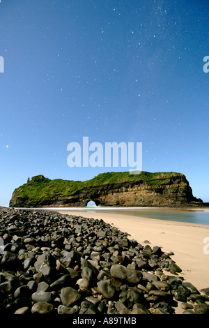 Night-time, moonlit view of 'Hole in the Wall' along the wild coast in South Africa's Eastern Cape Province. Stock Photo