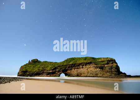 Night-time, moonlit view of 'Hole in the Wall' along the wild coast in South Africa's Eastern Cape Province. Stock Photo