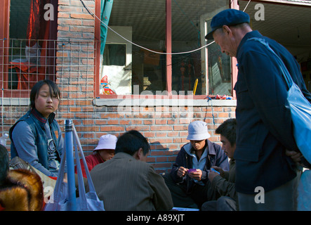 CHINA SIMITAI Chinese constructions workers take a break from work to play cards in their village near the Great Wall Stock Photo
