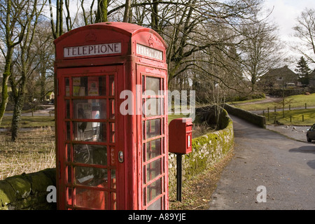 UK Yorkshire Wharfedale Linton village K6 phone box at old stone bridge over Linton Beck Stock Photo