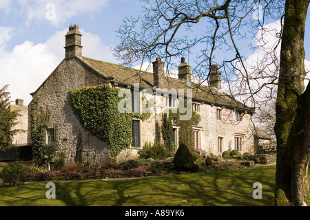 UK Yorkshire Wharfedale Linton village stone cottage beside Linton Beck Stock Photo