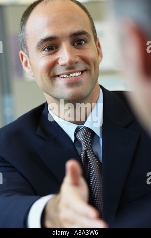 Businessman with food in his teeth Stock Photo