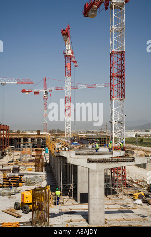 Workmen on construction site extending airport facilities in 2007 Malaga Spain Stock Photo