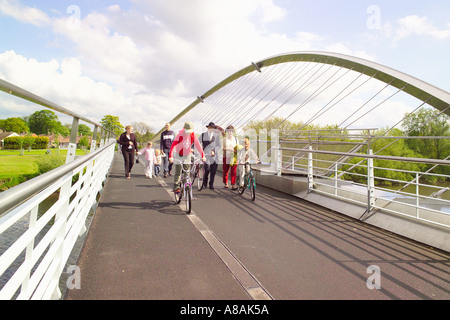 Pedestrians and cyclists on the Millennium Bridge which crossed the river Ouse in York. North Yorkshire, UK. Stock Photo