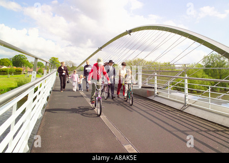 Pedestrians and cyclists on the Millennium Bridge which crossed the river Ouse in York. North Yorkshire, UK. Stock Photo