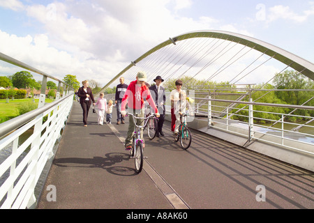 Pedestrians and cyclists on the Millennium Bridge which crossed the river Ouse in York. North Yorkshire, UK. Stock Photo