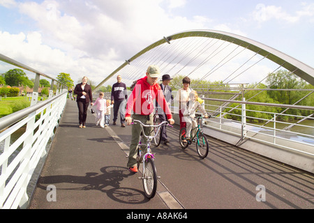 Pedestrians and cyclists on the Millennium Bridge which crossed the river Ouse in York. North Yorkshire, UK. Stock Photo