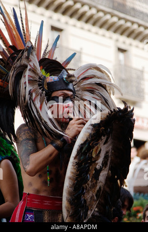 An AZTEC DANCER performs in a traditional warrior feathered COSTUME during the CERVANTINO FESTIVAL GUANAJUATO MEXICO Stock Photo