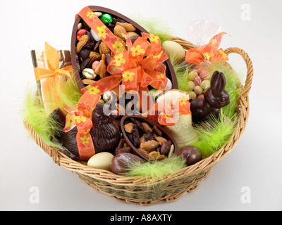 Wicker basket full of French chocolate eggs and animals editorial food Stock Photo