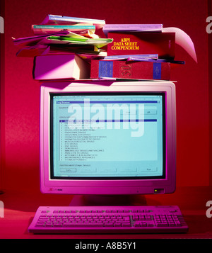 old style computer with stack of books Stock Photo