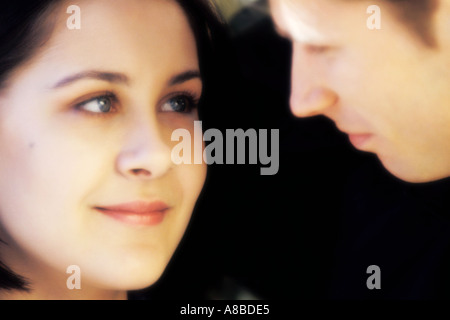 Young loving couple smiling to each other Stock Photo