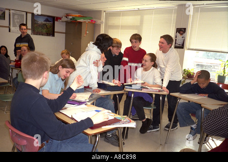 Group of students age 14 discussing school classroom project. Golden Valley Minnesota USA Stock Photo
