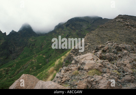 A view of Mount Aso active volcano with steam rising from the crater and pink rocks on Kyushu island, Japan, Asia. Stock Photo