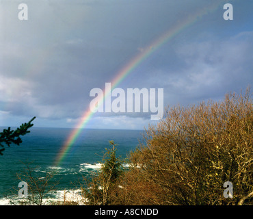 Rainbow over waves Stock Photo - Alamy
