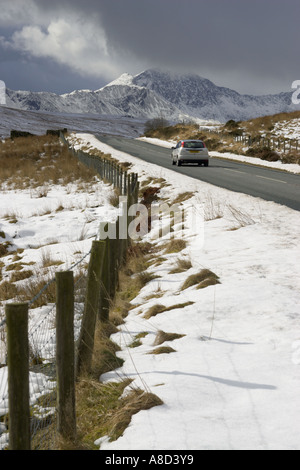 Snow in Snowdonia with car, North Wales Stock Photo