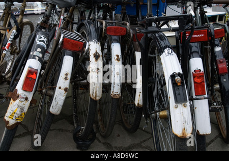 Detail of many parked bicycles in central Amsterdam Holland Stock Photo