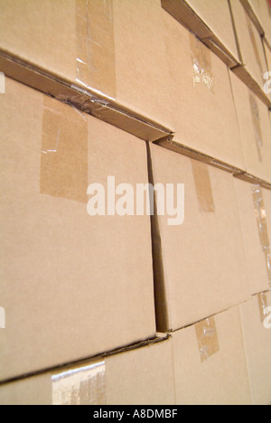 cardboard boxes stacked in a warehouse Stock Photo