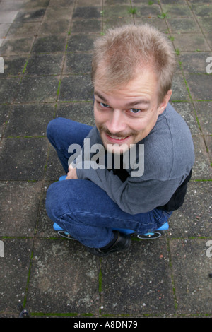 Happy man on toy car toycar Stock Photo