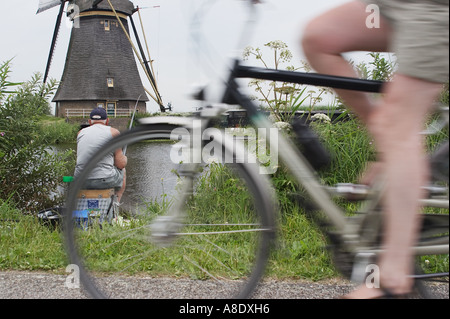 Man cycling with fishing rod hi-res stock photography and images - Alamy