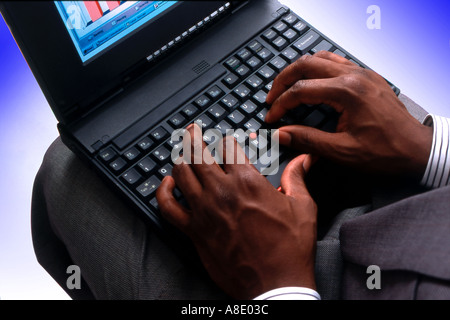 black male hands on laptop keyboard Stock Photo