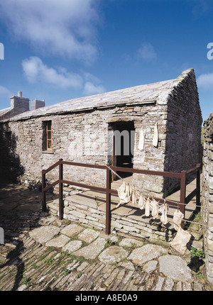 dh Kirbuster farm museum BIRSAY ORKNEY Dried fish and entrance to farm house Stock Photo