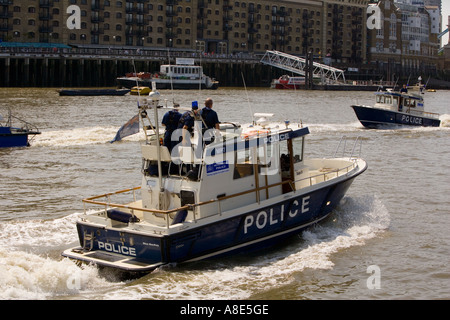 Police Patrol Boat 'Nina MacKay' meeting 'Sir Robert Peel' on the Thames Stock Photo