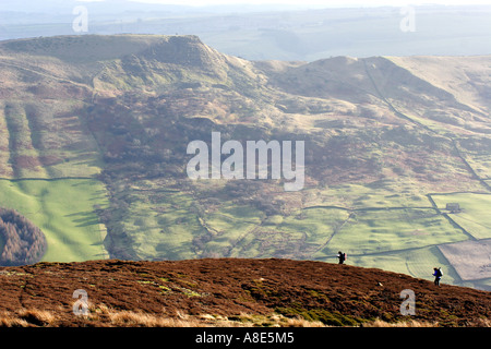 Two people hillwalking on a hill, Kindre Scout in the Peak District National Park,  Derbyshire, Near Sheffield, Stock Photo