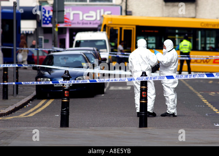 a Police forensics team investigate a stabbing in Nottingham city centre Stock Photo