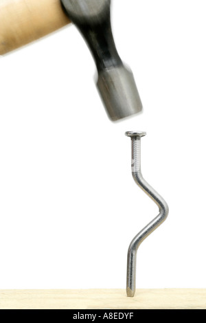 Hammering Bent Nail Stock Photo