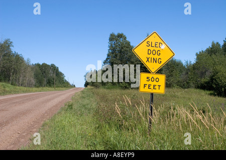 Warning sign for a dogsled crossing Stock Photo