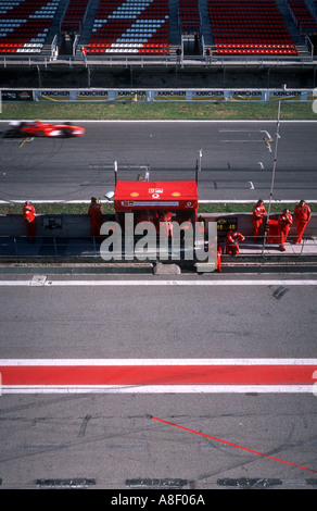 Panoramic view of the racing track and pit lane with mechanics at ...