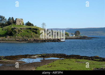 The ruins of 13th century Aros Castle on the Mull coast overlooking the Sound of Mull.  The castle was built by the MacDonald’s Stock Photo