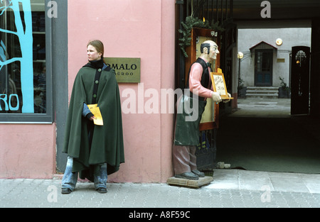 Young woman dressed in medieval cloth touting on the street Stock Photo