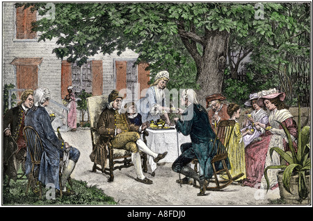Ben Franklin Alexander Hamilton and others discuss the framing of the new United States Constitution in Philadelphia 1787. Hand-colored woodcut Stock Photo