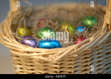 Colorful Easter Eggs in a Basket Stock Photo