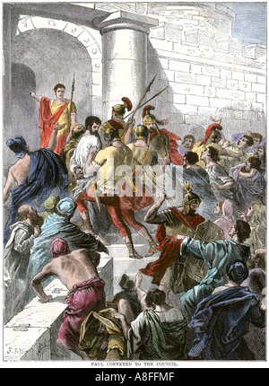 Paul arrested in Jerusalem and taken to the Roman authorities. Hand-colored woodcut Stock Photo