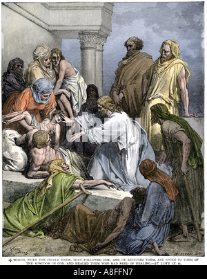 Jesus healing the sick and the lame. Hand-colored woodcut Stock Photo