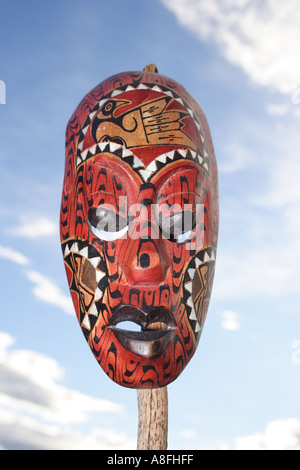 TRIBAL MASK FROM BALI IN FRONT OF BLUE SKY BAPD1236 Stock Photo