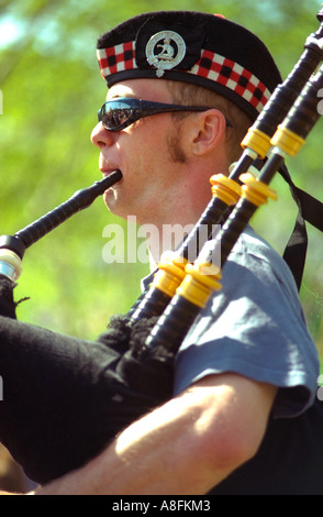Scottish bagpiper age 38. In the Heart of the Beast May Day Festival and Parade Minneapolis Minnesota USA Stock Photo