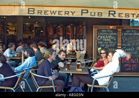 Paris Cafe, France, Crowd Young People Sharing Beer, in English Style Pub, Bar "The Frog and Roastbeef" in the Bercy District, drinks terrace holiday, Stock Photo