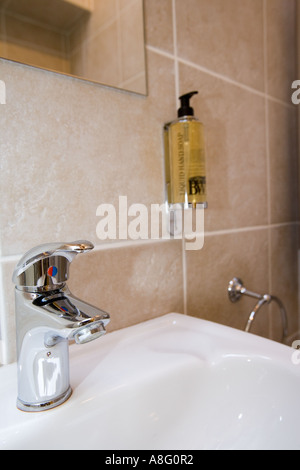 A closer look of the round soap holder in the sink inside the bathroom  Stock Photo - Alamy