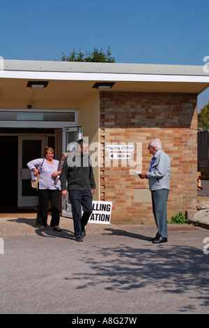 Man standing outside Polling Station checking off names for local council elections in Sussex Stock Photo