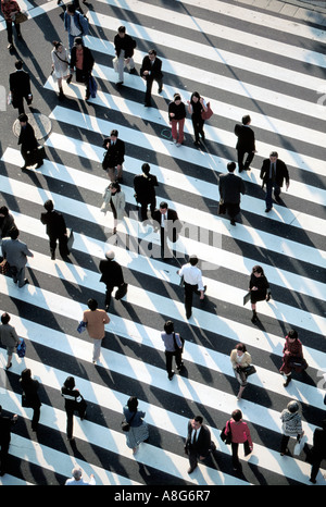 people and businessmen on pedestrian crossing in intersection, Ginza, Tokyo, Japan Stock Photo