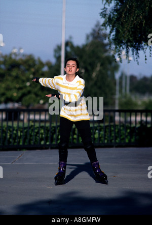 13 year old girl inline skating in California Stock Photo