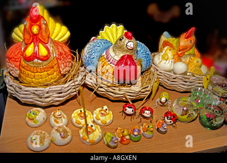 Thai ceramic novelties featuring chickens and hens laying, on sale on a street stall in Bangkok Thailand Stock Photo