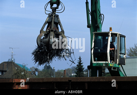 Metal for recycling being loaded onto railway wagons at Solingen, North Rhine-Westphalia, Germany. Stock Photo