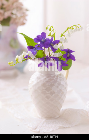 Floral arrangement of Violets and Lily of the Valley in a miniature ...